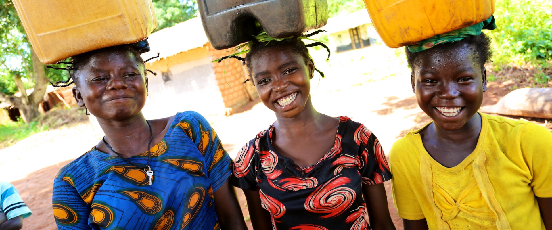 3 women carrying water